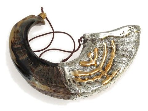 Anointing horn: silver with a gold menorah, on a cord
