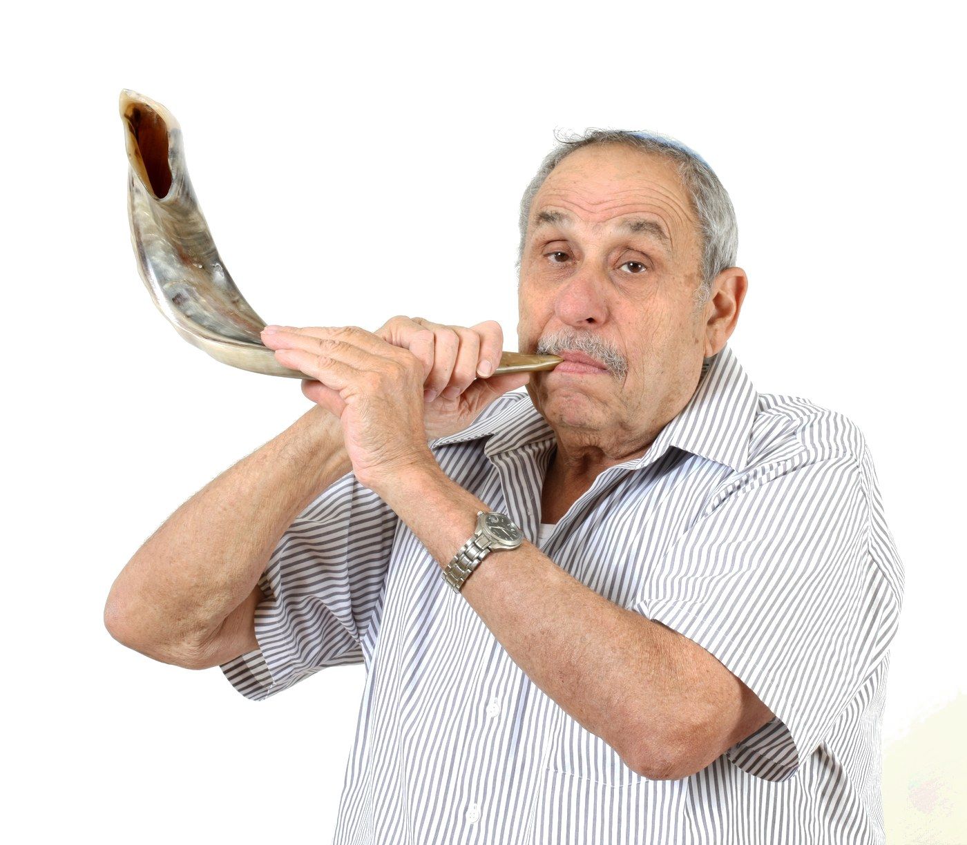 Avraham Ribak, of blessed memory, sounding a ram’s horn shofar