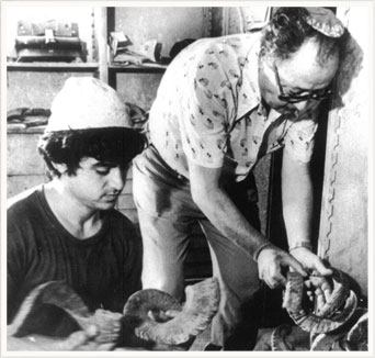 Meir Bar-Sheshet and his son Zvi examining horns.